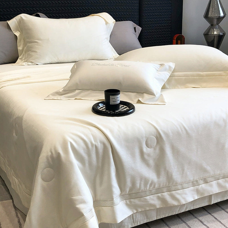 Premium bedding set made of cotton satin with subtle circle stitching and hotel closure