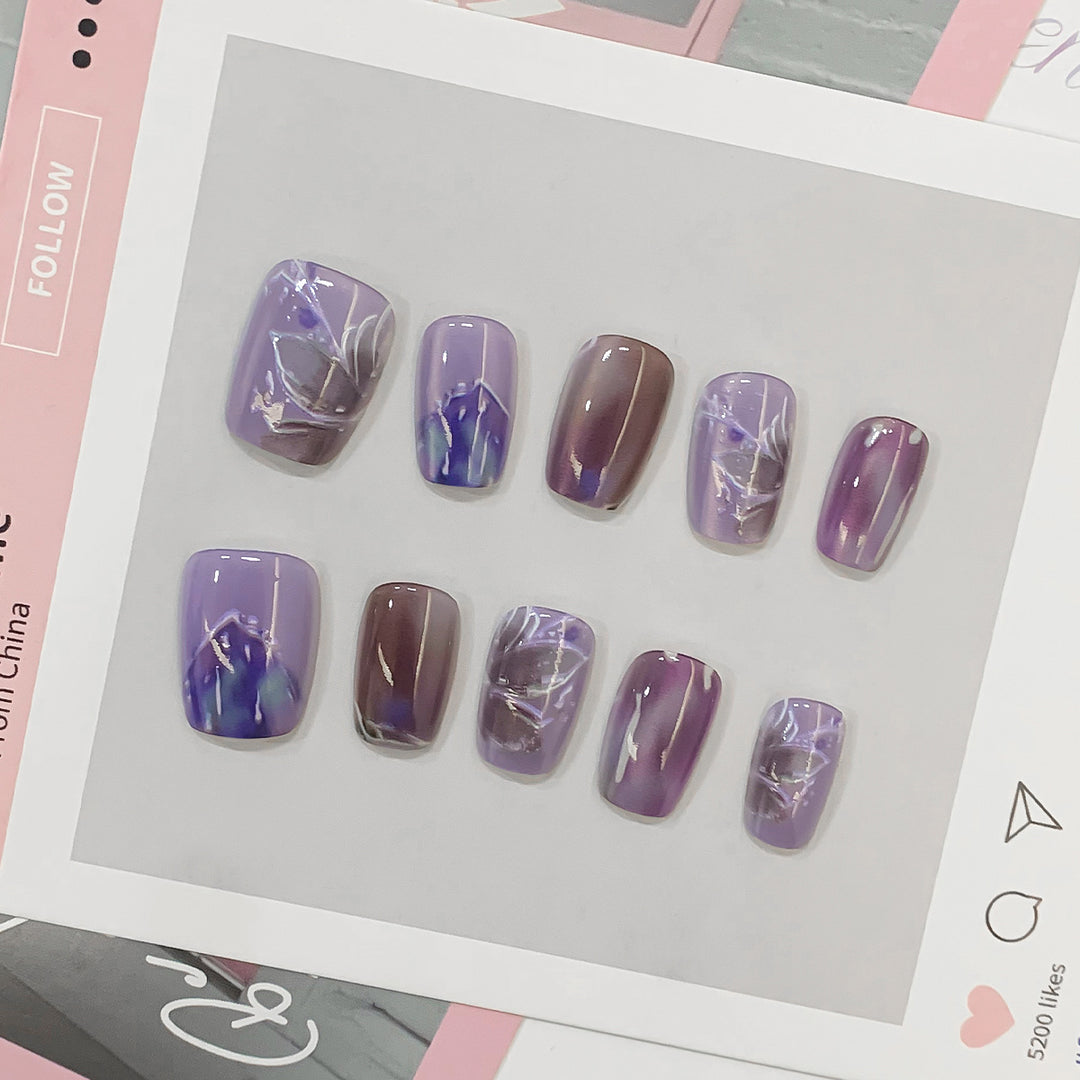 Artful acrylic nails with marbled design Stornfield