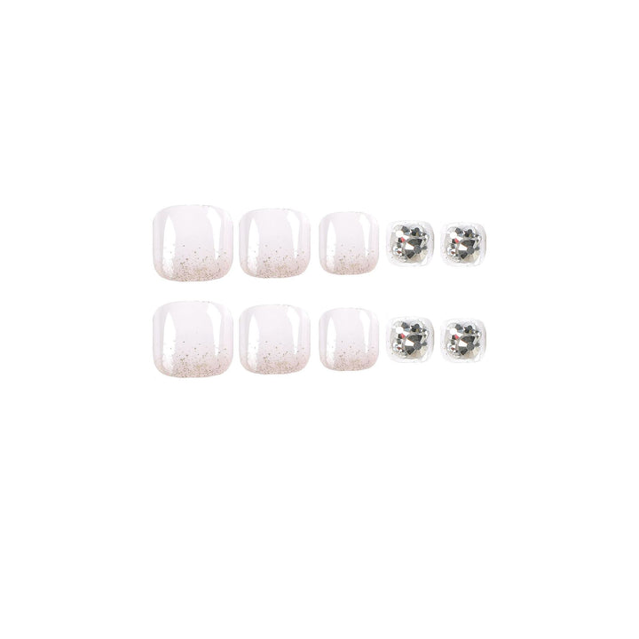 Artful toenail design with sparkling embellishments Stornfield