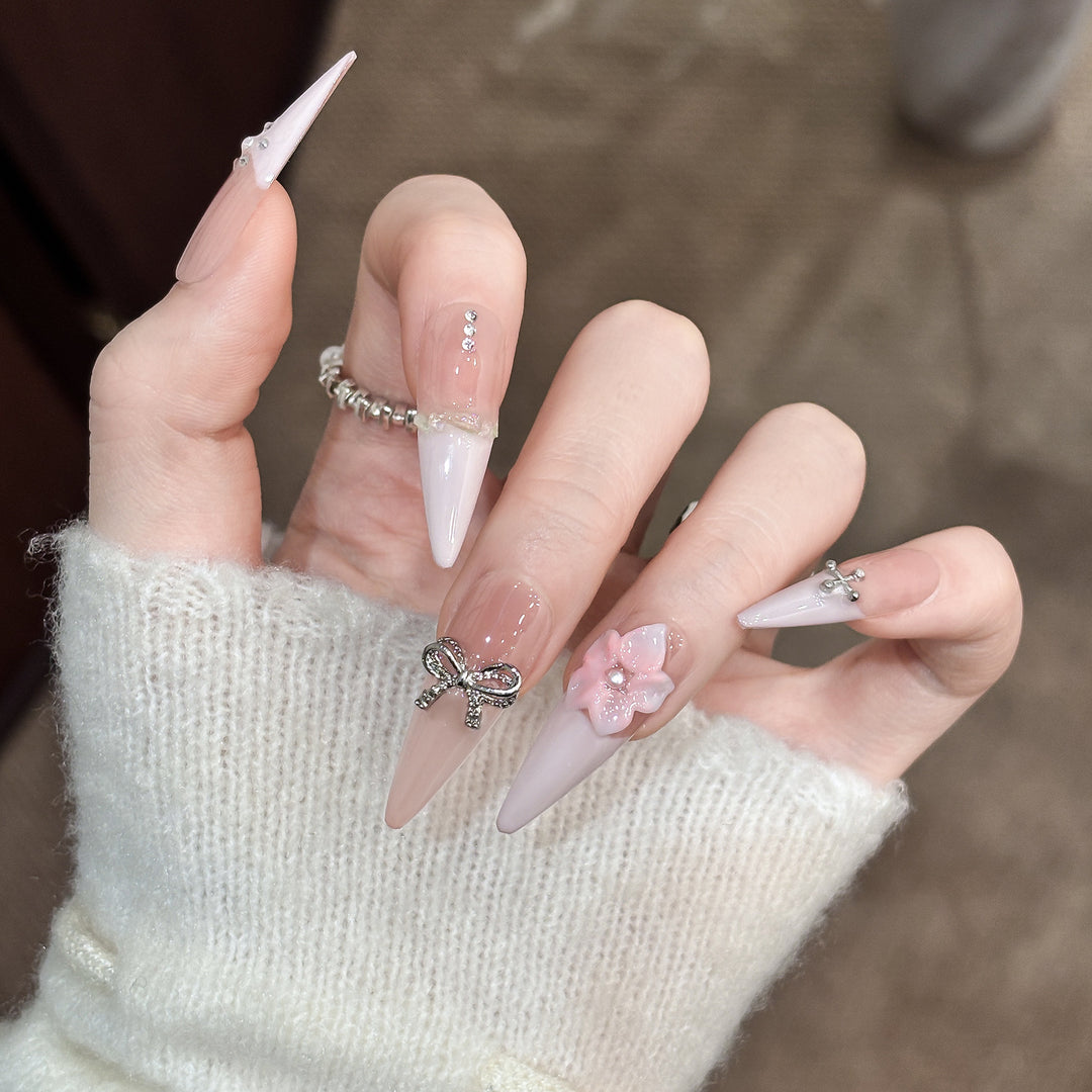Decorative Stiletto Press-On Nails with Floral Accents and Gem Details