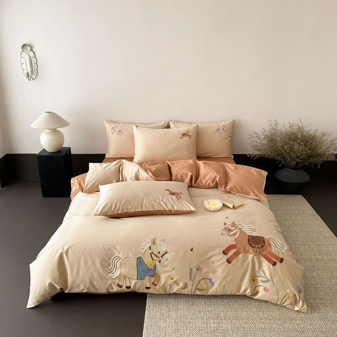 Children's satin bed linen set with embroidered rocking horse applications and velvety texture