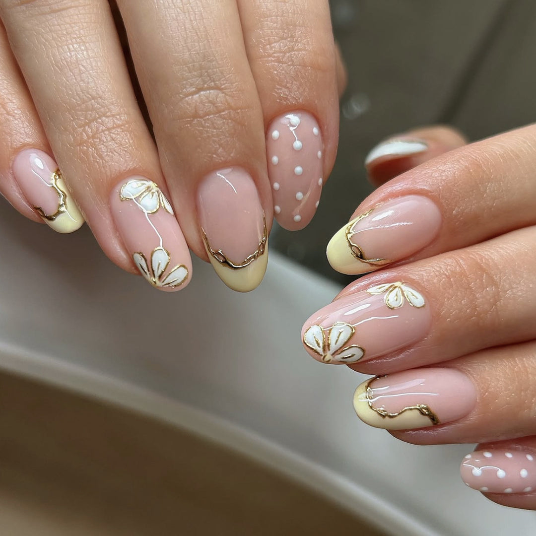 Artful Nail Extensions with Floral Design and Elegant Gold Accents Stornfield