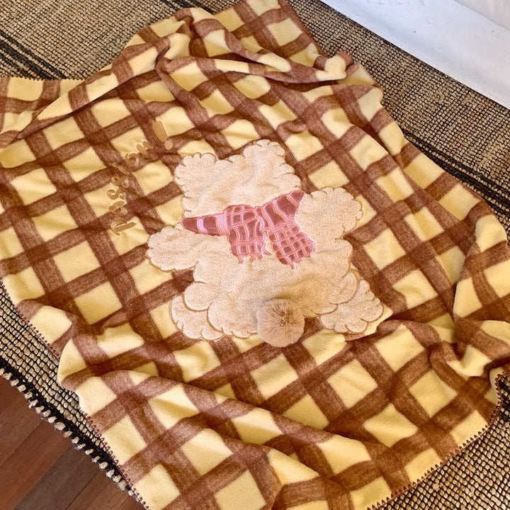 Cuddle blanket with teddy applique and checkered fleece