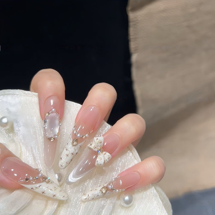 Artificial nails with elegant accents and rhinestone embellishments Stornfield