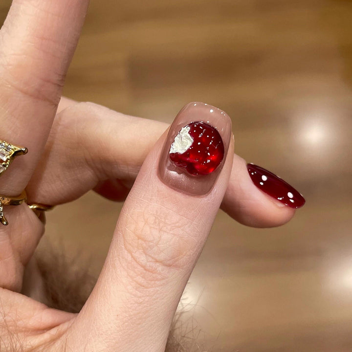 Artificial nails with festive gift design Stornfield
