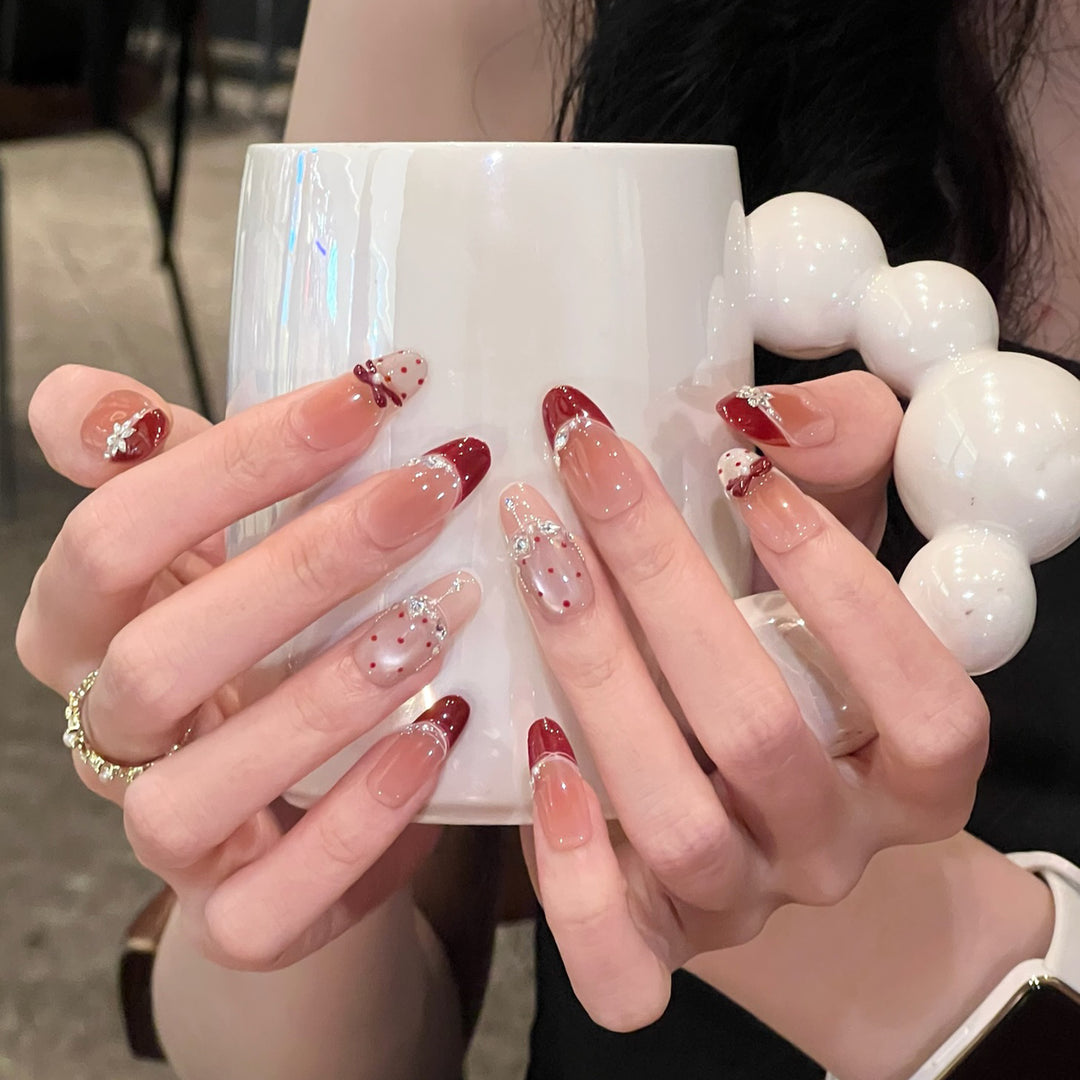 Artistic Stiletto Nail Enhancements with Decorative Accents