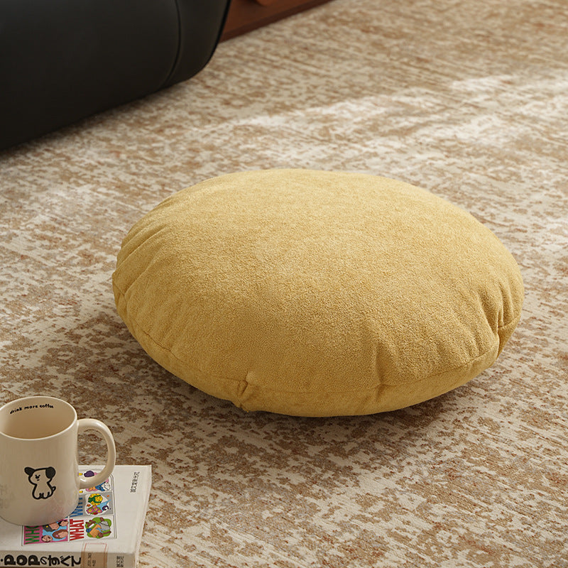 Round floor seat pouf made of teddy plush with a shape-retaining padded core Stornfield