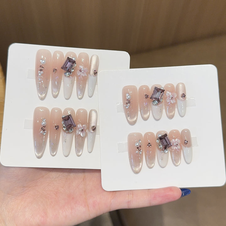 Artificial nails with elegant jewelry details Stornfield
