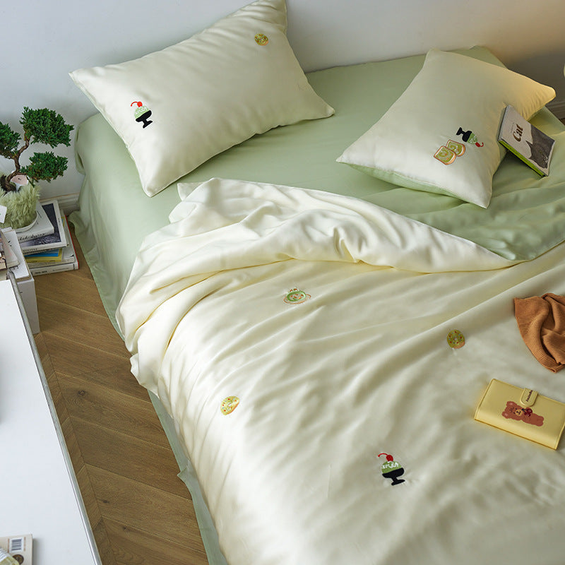 Reversible cotton satin bedding set with fitted sheet and subtle embroidery appliqués