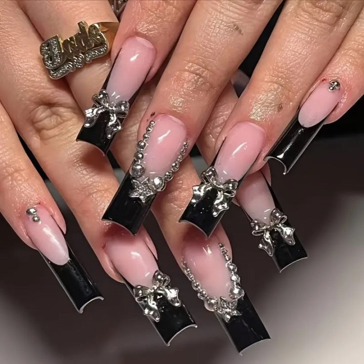 Artificial nail set with glamorous rhinestone accents and elegant 3D designs Stornfield