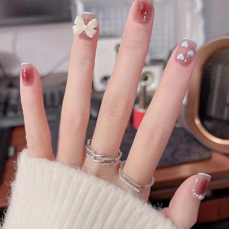 Artistic and elegant nail art with bow accents Stornfield