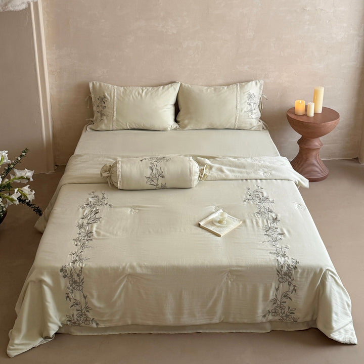 Elegant bedding set made of cotton satin with floral embroidered border and decorative roll cushion Stornfield