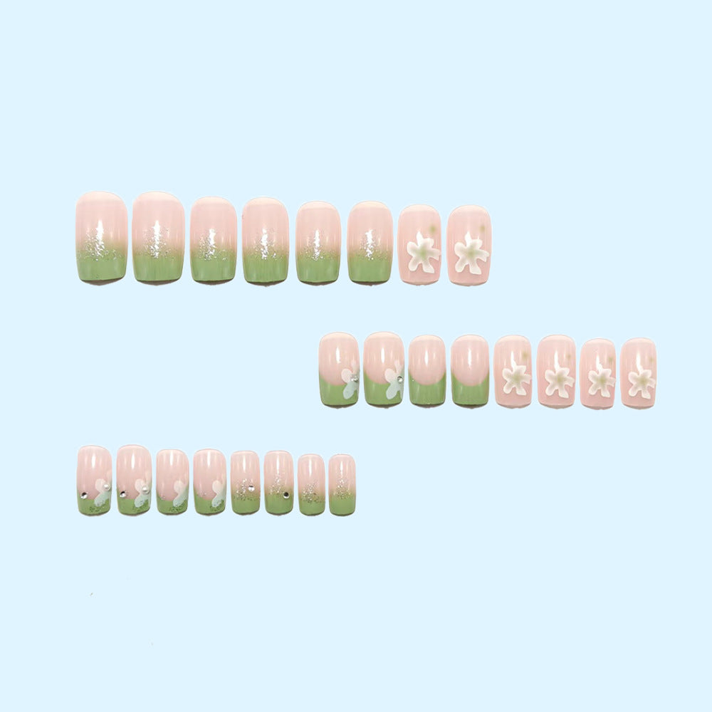 Artificial nails with floral accents and glitter coating Stornfield
