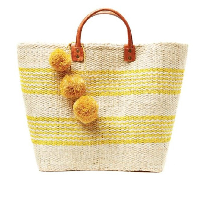 Stylish basket bag with playful pompons Stornfield
