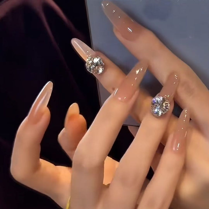 Acrylic nails with glamorous stone accents Stornfield