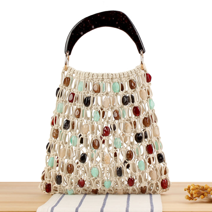 Fashionable handbag in creative net design with colorful accents Stornfield