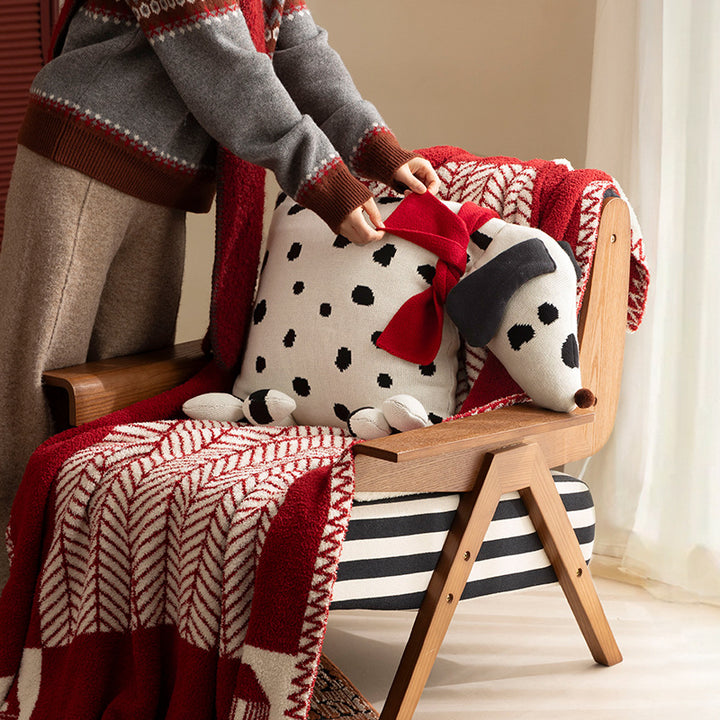 Decorative knitted cuddle pillow in the shape of a dog with a quilted body and bow detail Stornfield