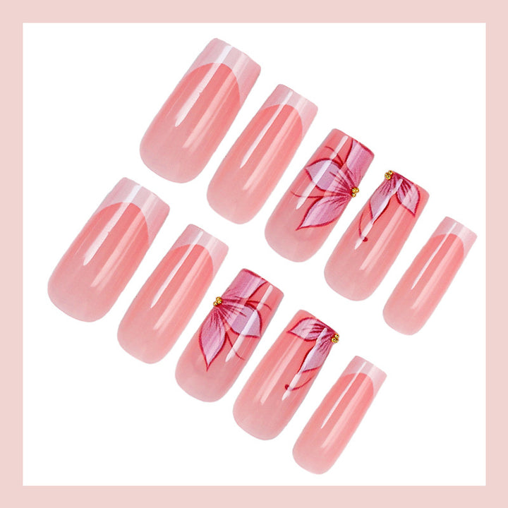 Artificial nail set with elegant flower designs and glitter accents Stornfield