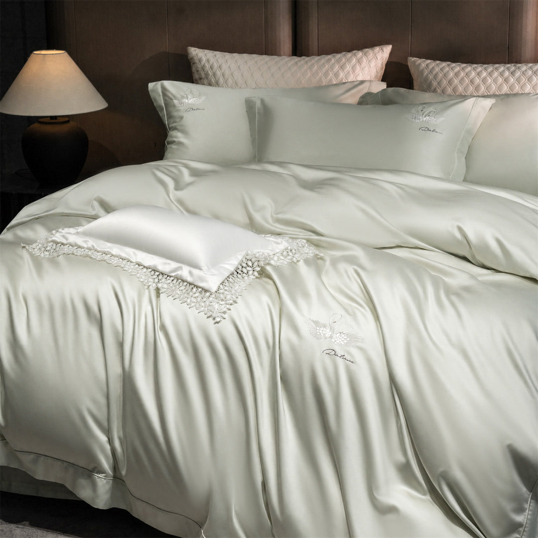 Luxurious satin bedding set with embroidered swan motif and lace pillow