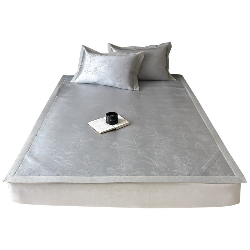 high-quality non-slip mattress protector with integrated fitted sheet and elegant jacquard pattern