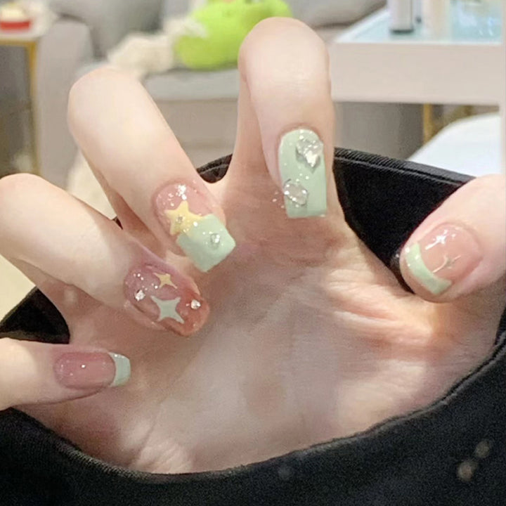 Artistic Press-On Nail Set with Glittery Star Accents Stornfield