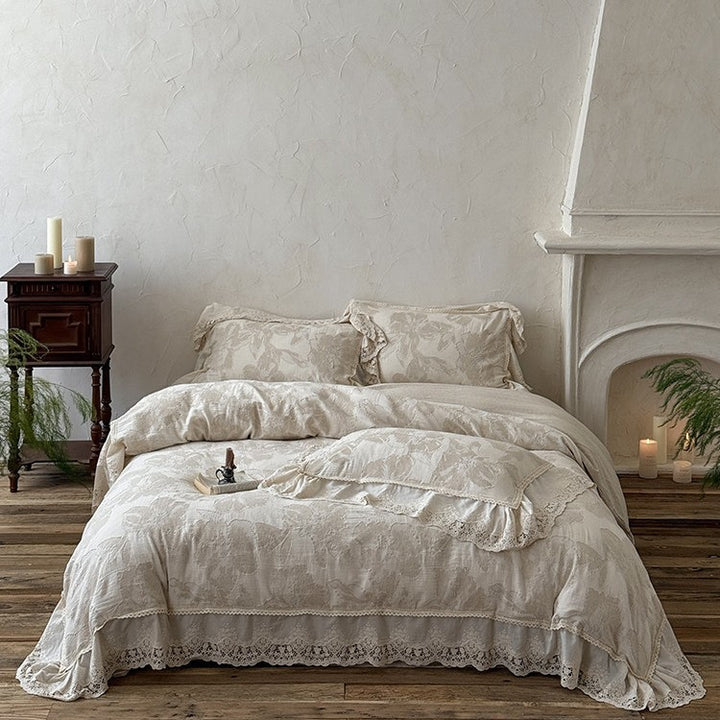 Vintage-inspired cotton-linen bedding set with large floral pattern, ruffle, and lace appliqué