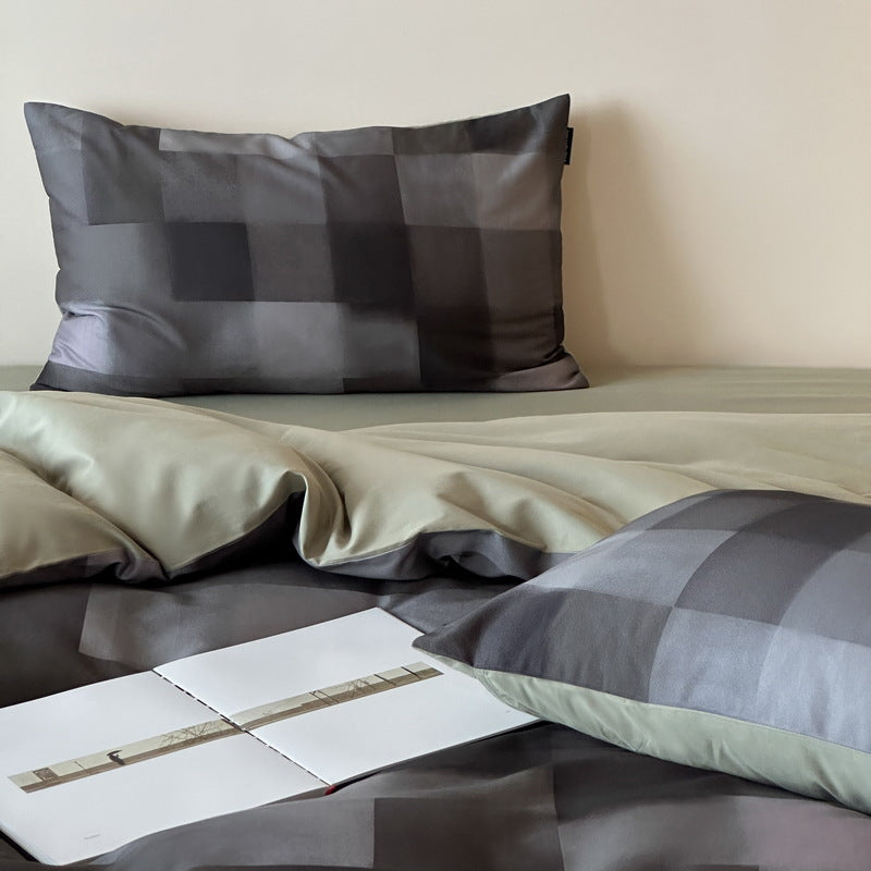 Reversible cotton satin bedding set with fine striped pattern and contrasting backside