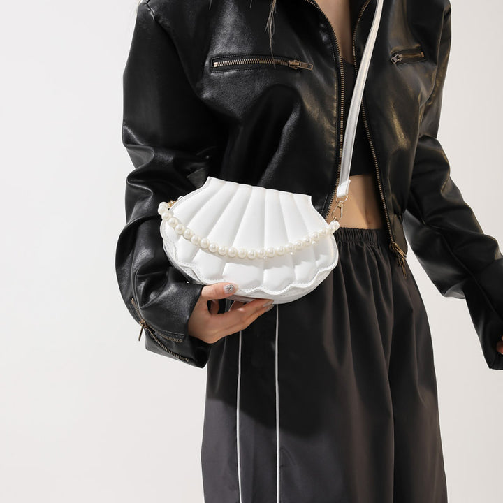 Elegant Pearl-Handled Clutch