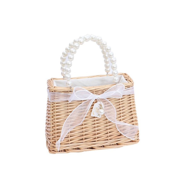 Ladies handbag made of braided material with elegant pearl handles Stornfield