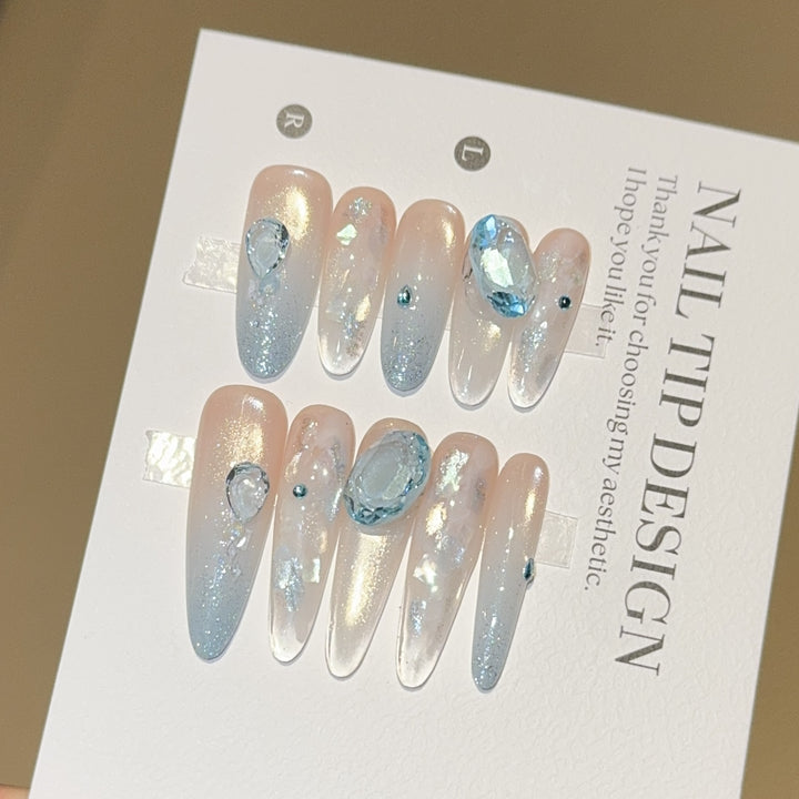 Artificial nails with rhinestones and glitter effects Stornfield