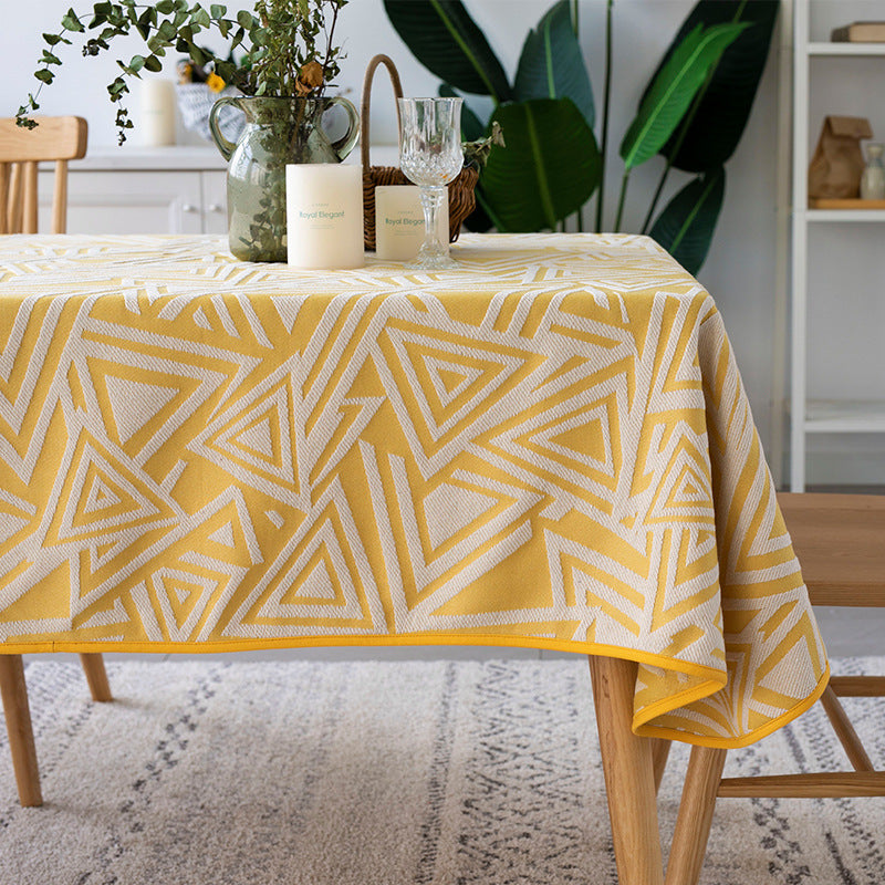 Woven jacquard tablecloth with geometric triangle pattern and easy-care cotton blend