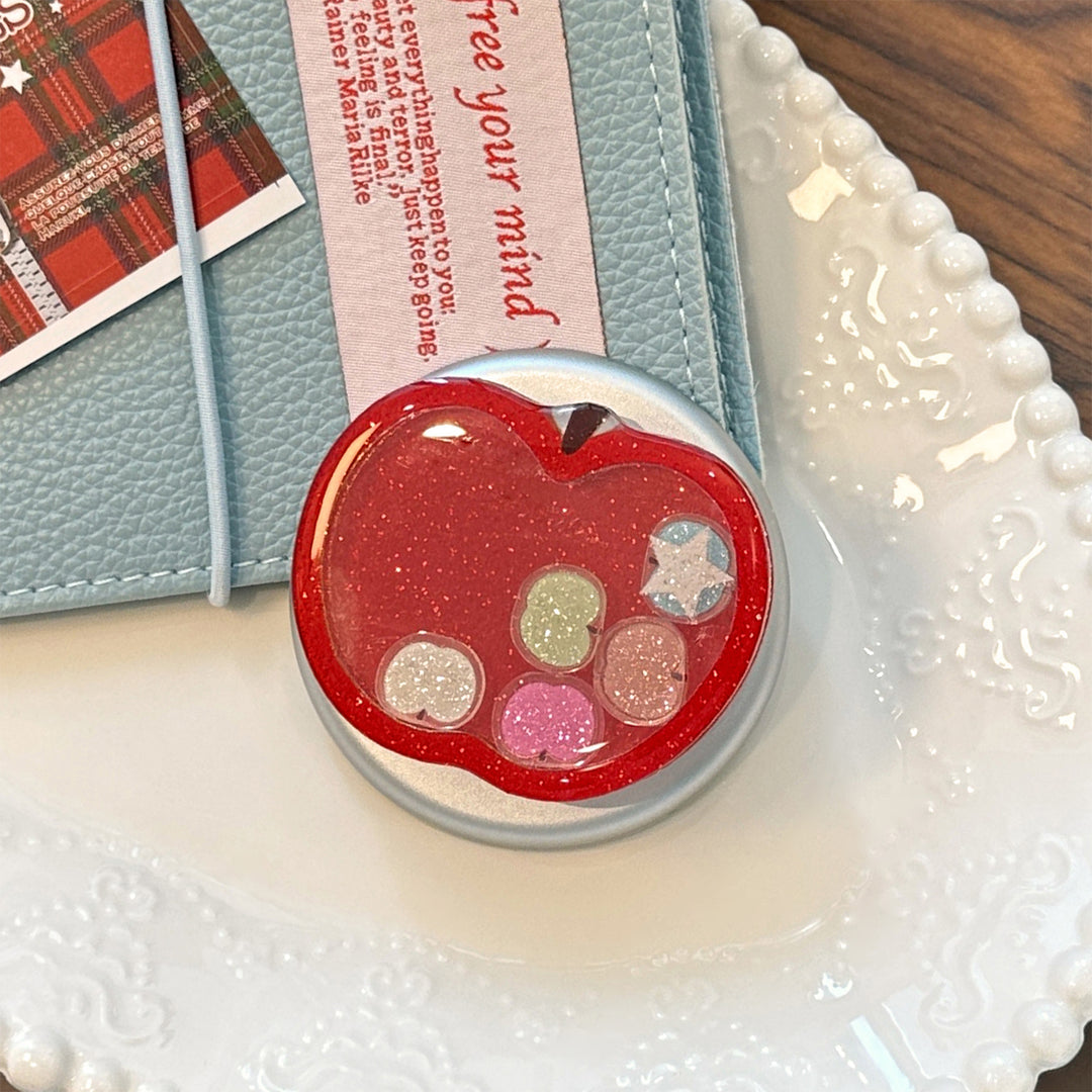Funnier apple motif smartphone finger holder Stornfield