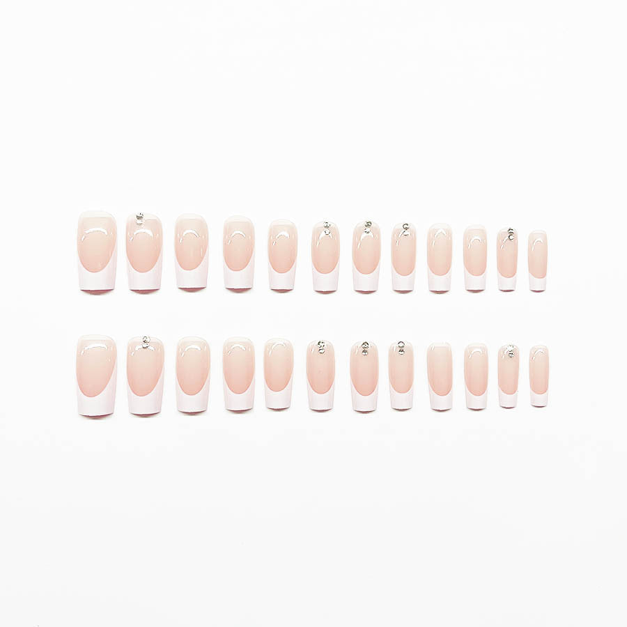 Elegant artificial nail set with high-gloss finish and rhinestone decorations Stornfield