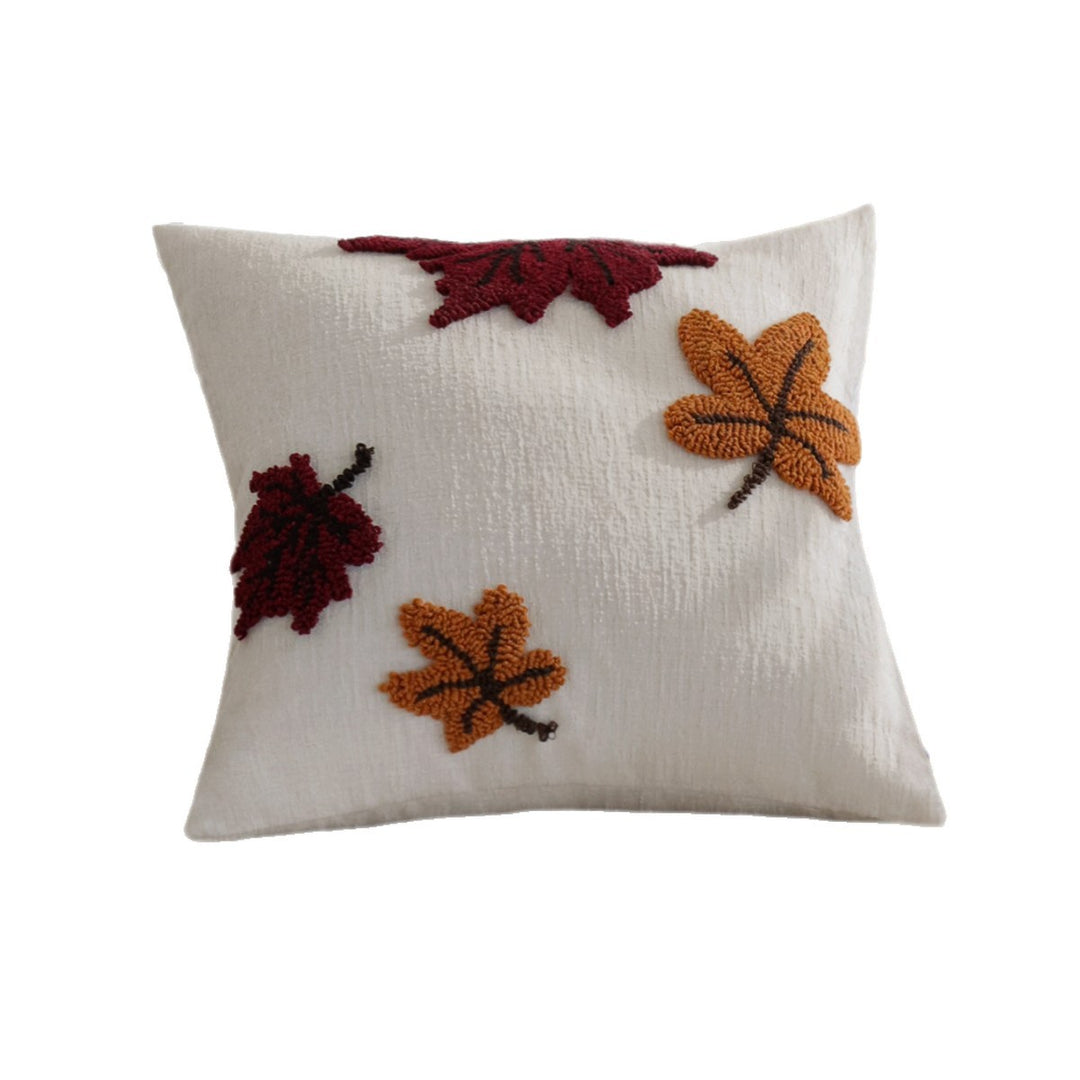 Square cushion cover with hand-tufted autumn leaf appliqués Stornfield