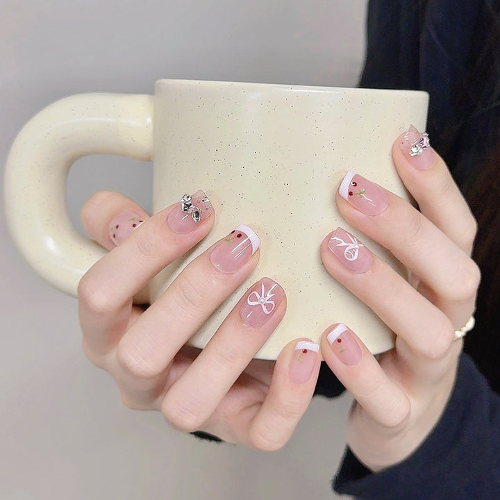 Decorative Press-On Nail Art with Floral and Bow Accents