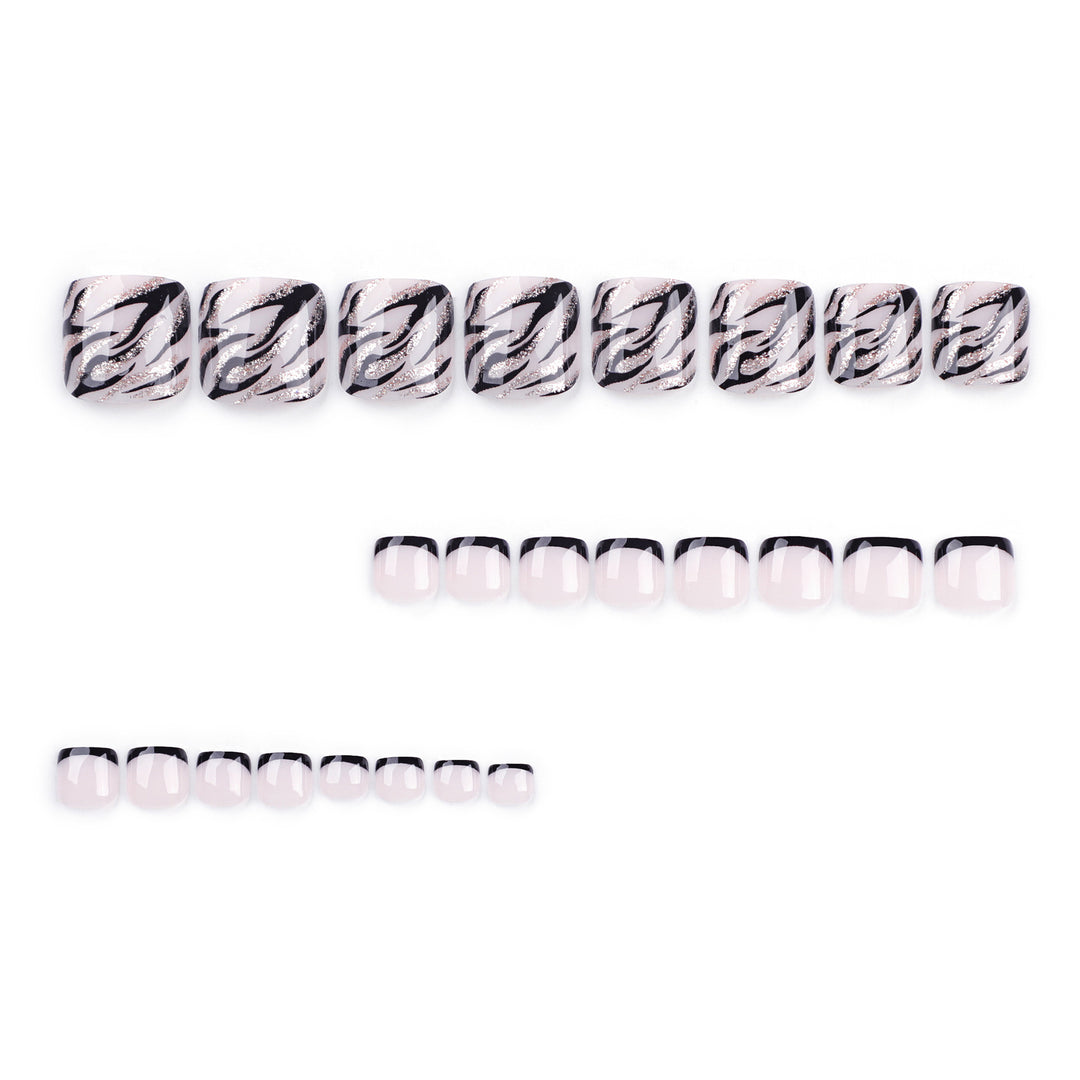 Artificial toenail art in elegant black and white design Stornfield