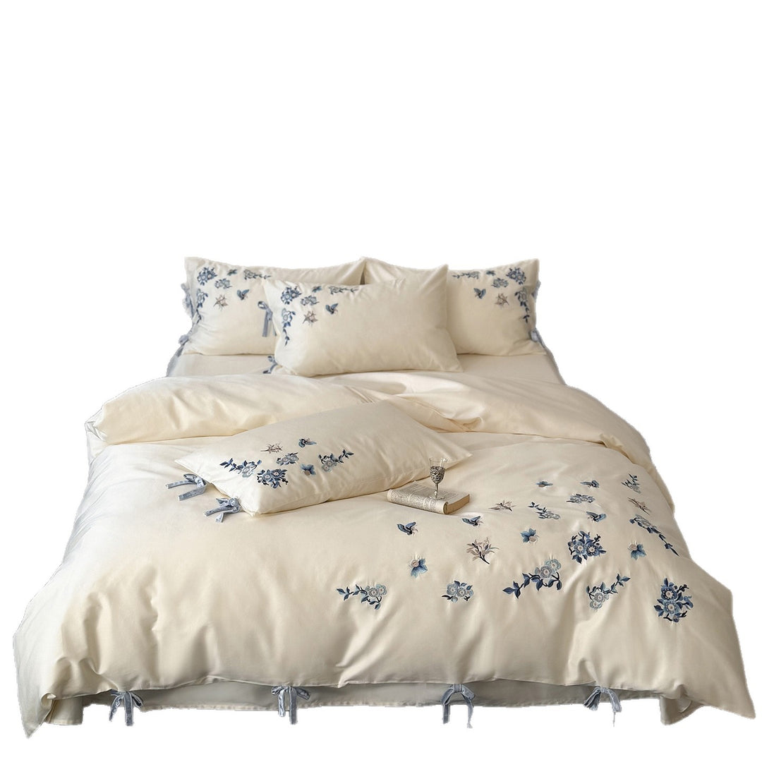 Embroidered satin bedding set with delicate floral details