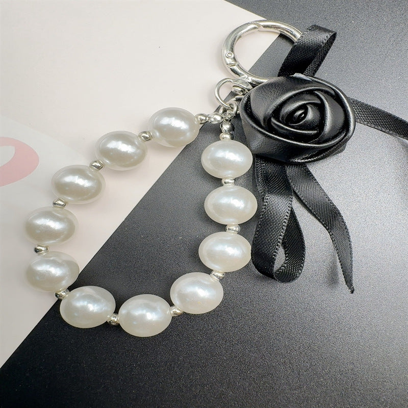 Elegant Pearl and Leather Charm Keychain Stornfield