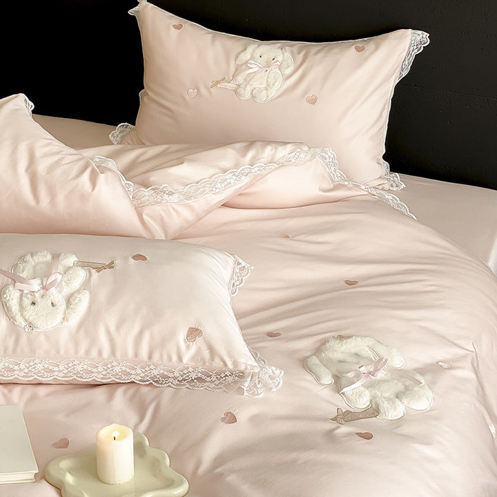 Luxurious satin bedding set with plush bunny appliqué and lace trim