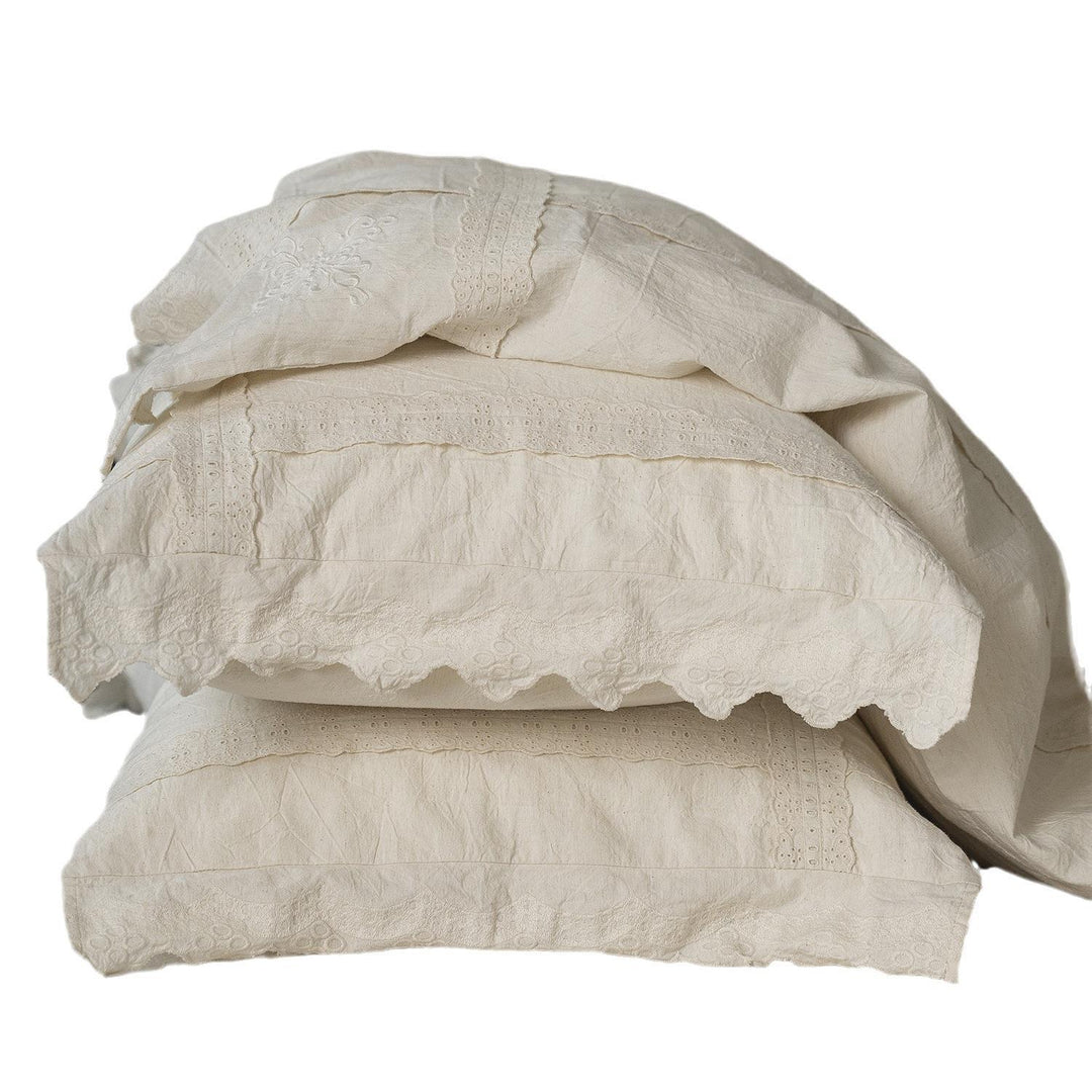 Bed linen set in vintage linen style with lace trim and embroidery detail