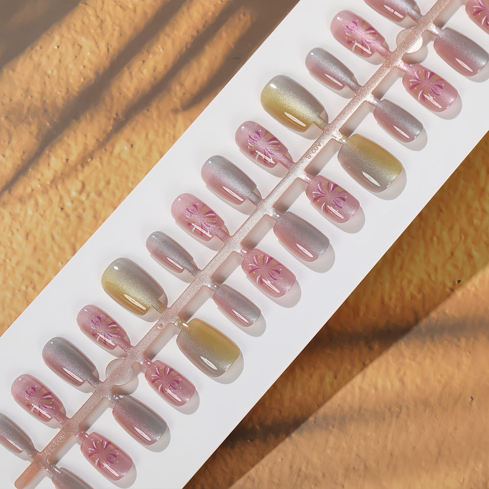 Artificial nails in modern ombre design with floral accents Stornfield
