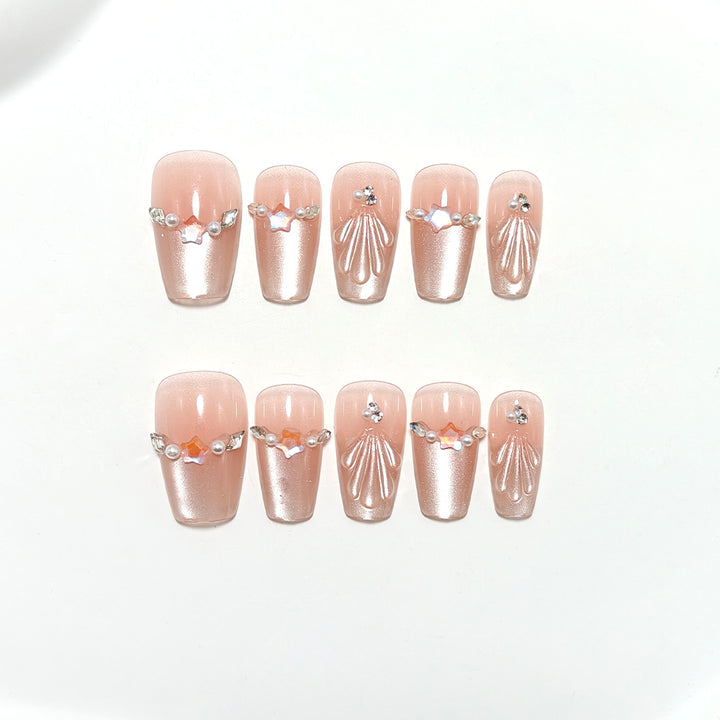 Exquisite artificial nails with glitter and pearl accents Stornfield