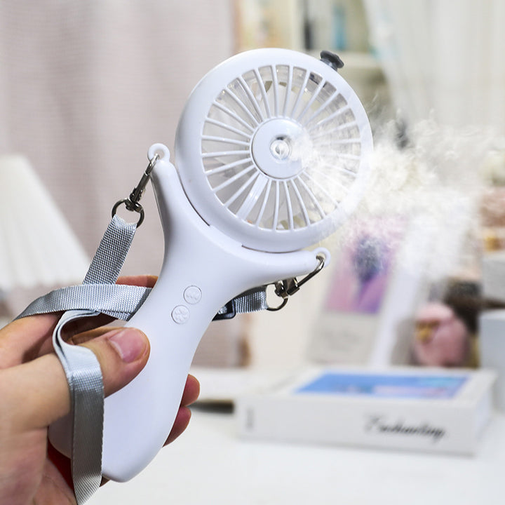 Women portable mini hand fan with spray function and ergonomic design Stornfield