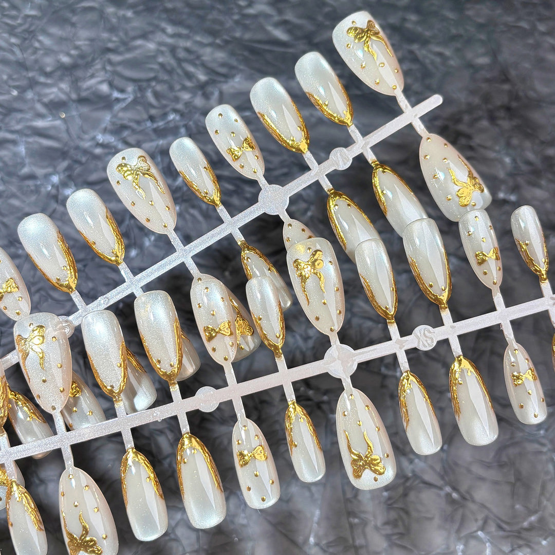 Elegant Press-On Nail Set with Gold Bow Accents