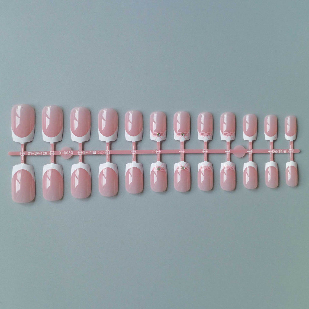 Elegant French Tip Nail Art Set with Delicate Bow Accents