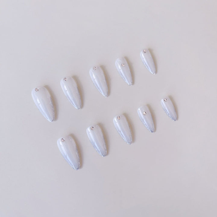 Acrylic nail set with elegant tips and sparkling accents Stornfield