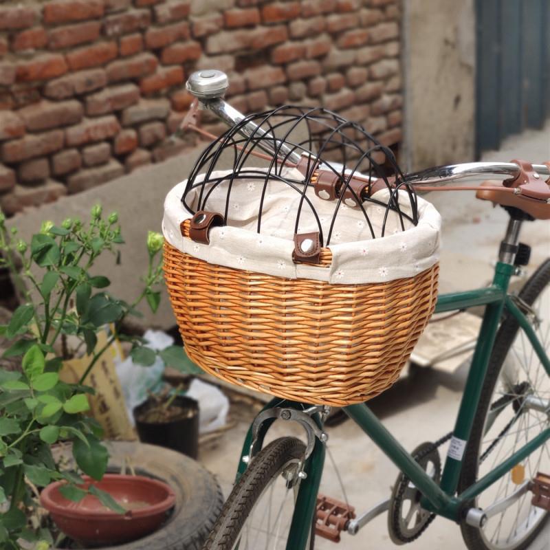 woven rattan pet carrier basket with detachable linen liner and foldable metal safety dome Stornfield