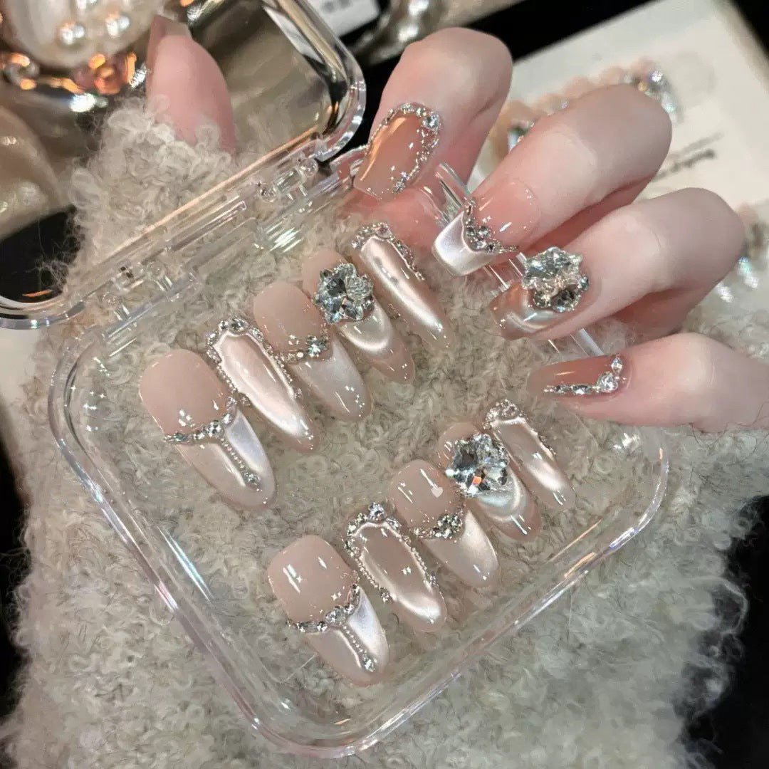 Glamorous nail tips with rhinestone and glitter effects Stornfield