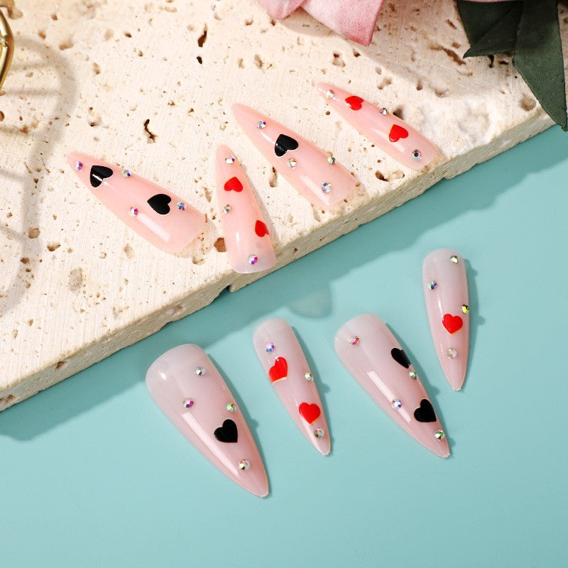 Glamorous artificial nails with heart accents Stornfield
