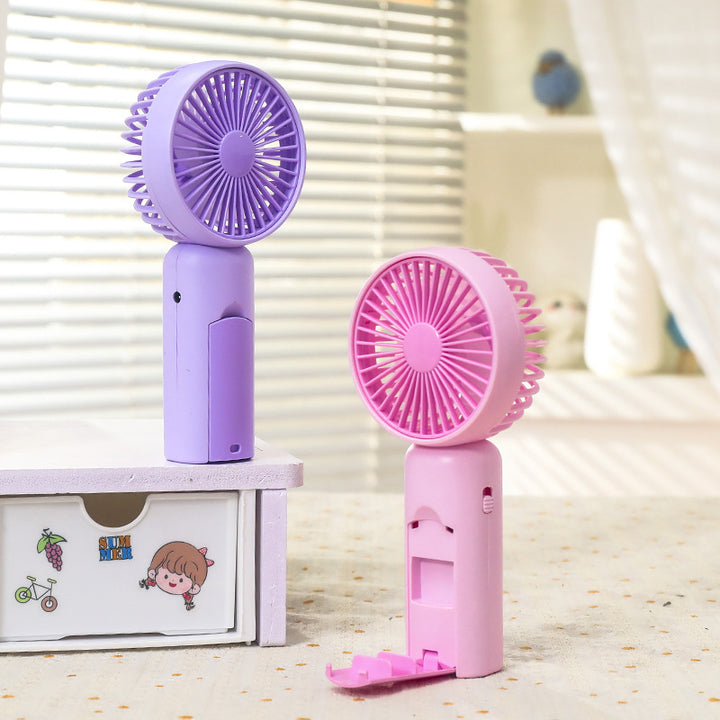 Women portable mini hand fan with USB charging function and ergonomic design Stornfield